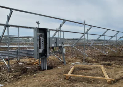 A solar panel is being installed in a field.